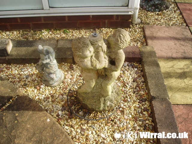 Attached picture garden cherub 1.JPG